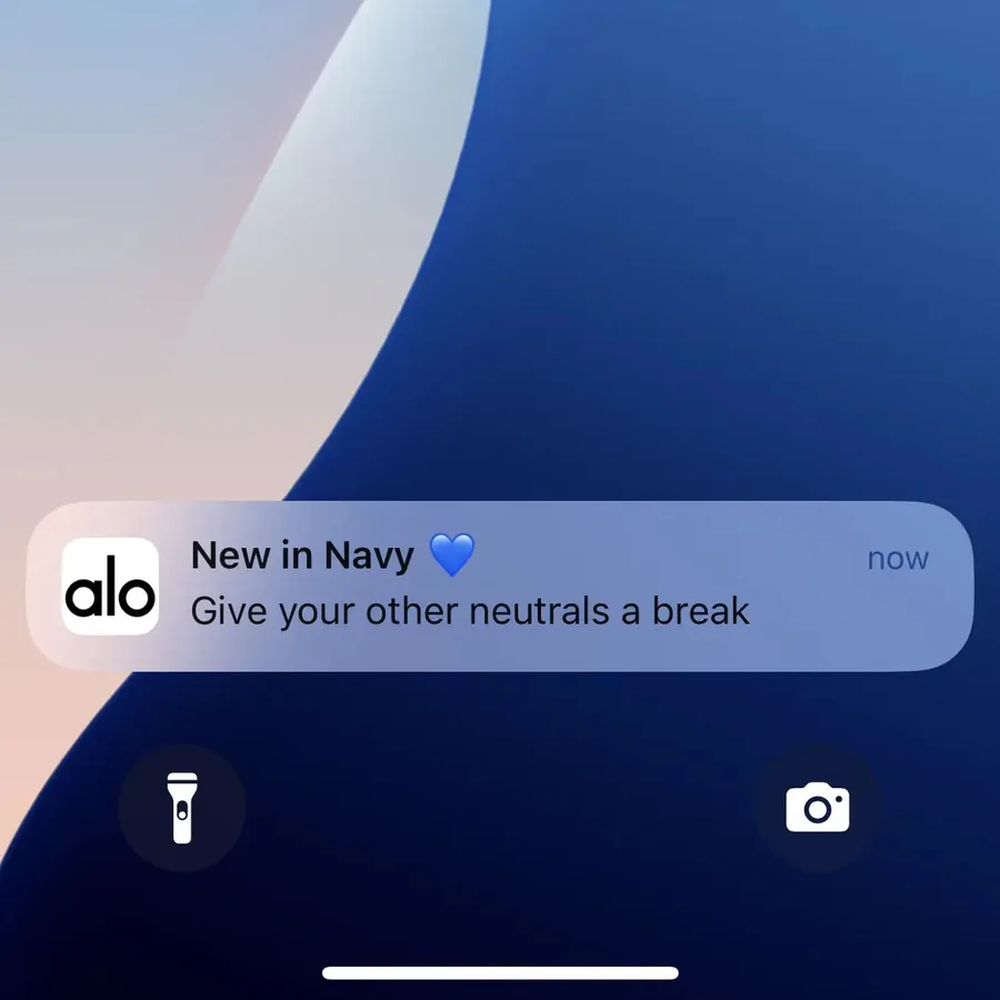 Alo Yoga push notification: New in Navy. Give your other neutrals a break