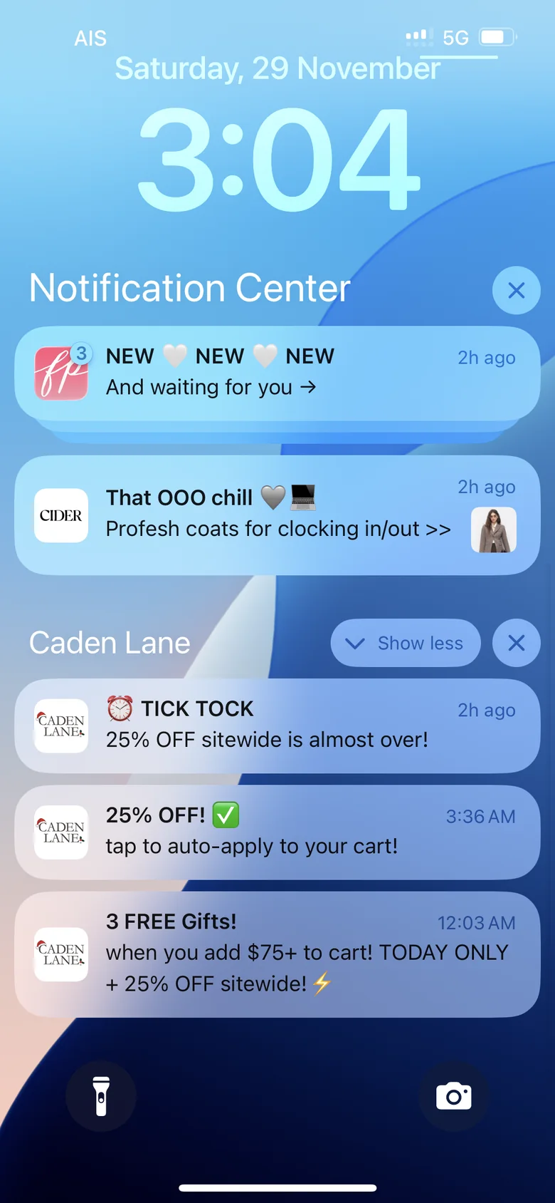 An iPhone lock screen on Black Friday weekend with push notifications from Free People, Cider and Caden Lane about new arrivals, coats and a 25% off sale